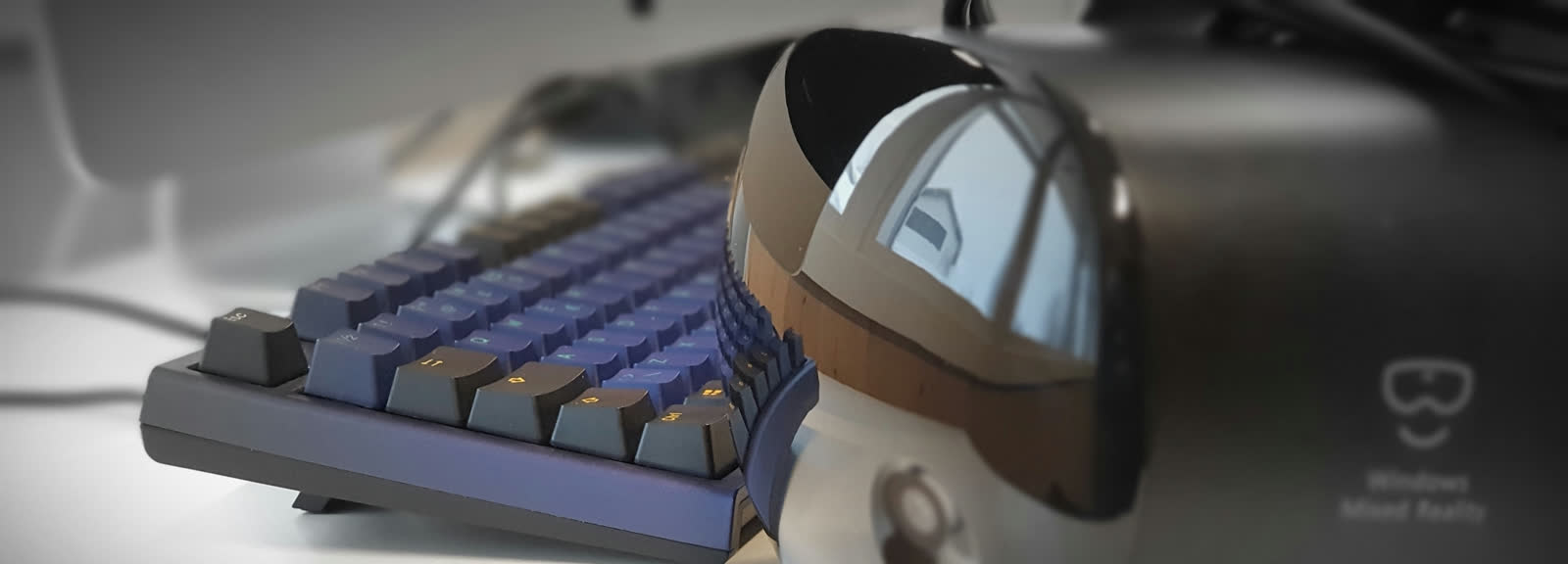 VR headset and keyboard on a desk